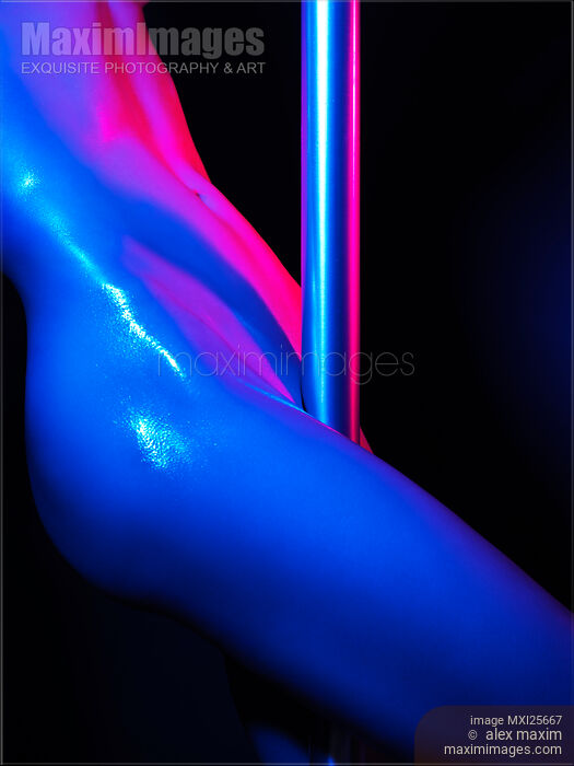 Stock photo of Nude woman pole dancing closeup of body Buy commercial use license at MaximImages