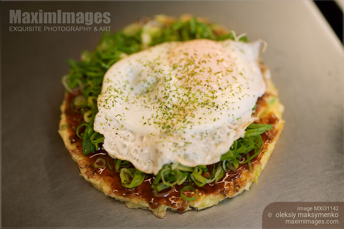 Stock photo of Okonomiyaki traditional Japanese cuisine in a Kyoto restaurant Buy commercial use license at MaximImages