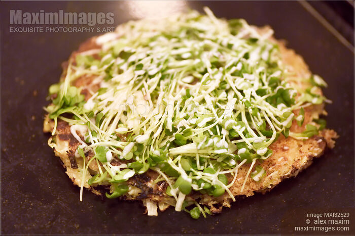 Okonomiyaki with radish sprouts traditional Japanese cuisine in Kyoto restaurant Stock photo of Okonomiyaki with radish sprouts traditional Japanese cuisine in Kyoto restaurant Buy commercial use license at MaximImages