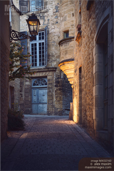 Old street with stone houses and a lantern in a historic town of Sarlat France Stock photo of Old street with stone houses and a lantern in a historic town of Sarlat France Buy commercial use license at MaximImages