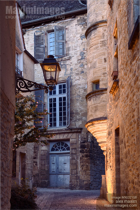 Stock photo of Old town streets with sandstone buildings at dawn in South of France Buy commercial use license at MaximImages