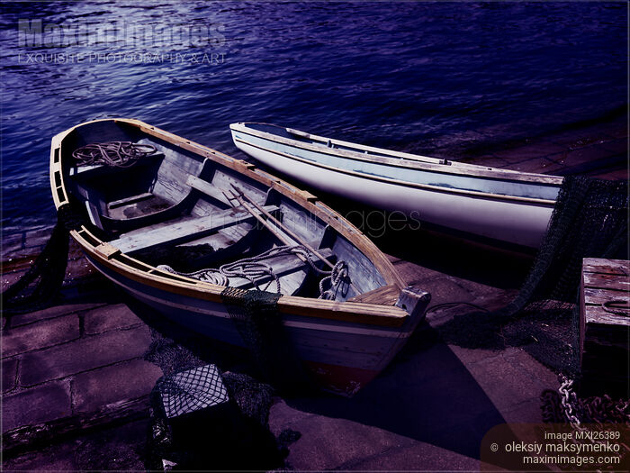 Old wooden boats at night Stock photo of Old wooden boats at night Buy commercial use license at MaximImages