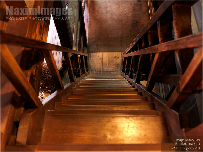 Old wooden staircase leading down Stock photo of Old wooden staircase leading down Buy commercial use license at MaximImages