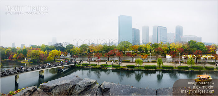 Osaka Castle Park canal with boats and Gokurakubashi bridge panoramic misty autumn city scenery Stock photo of Osaka Castle Park canal with boats and Gokurakubashi bridge panoramic misty autumn city scenery Buy commercial use license at MaximImages