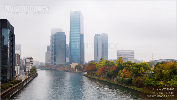 Osaka financial district towers on the banks of Okawa River in colorful misty autumn scenery Stock photo of Osaka financial district towers on the banks of Okawa River in colorful misty autumn scenery Buy commercial use license at MaximImages
