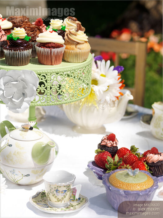 Outdoor tea party table with cupcakes Stock photo of Outdoor tea party table with cupcakes Buy commercial use license at MaximImages