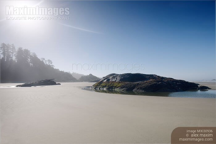 Pacific Rim National Park surreal morning scenery of the sandy beach during low tide in Tofino BC Stock photo of Pacific Rim National Park surreal morning scenery of the sandy beach during low tide in Tofino BC Buy commercial use license at MaximImages