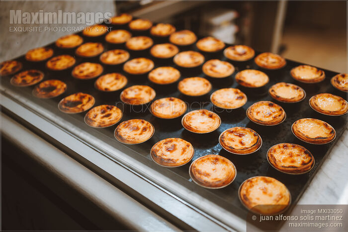 Pasteis de Nata Traditional Portuguese Custard Tarts in a pastry shop Stock photo of Pasteis de Nata Traditional Portuguese Custard Tarts in a pastry shop Buy commercial use license at MaximImages