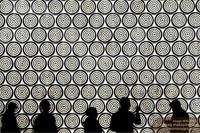People Aiming into Targets Stock photo of People Aiming into Targets Buy commercial use license at MaximImages