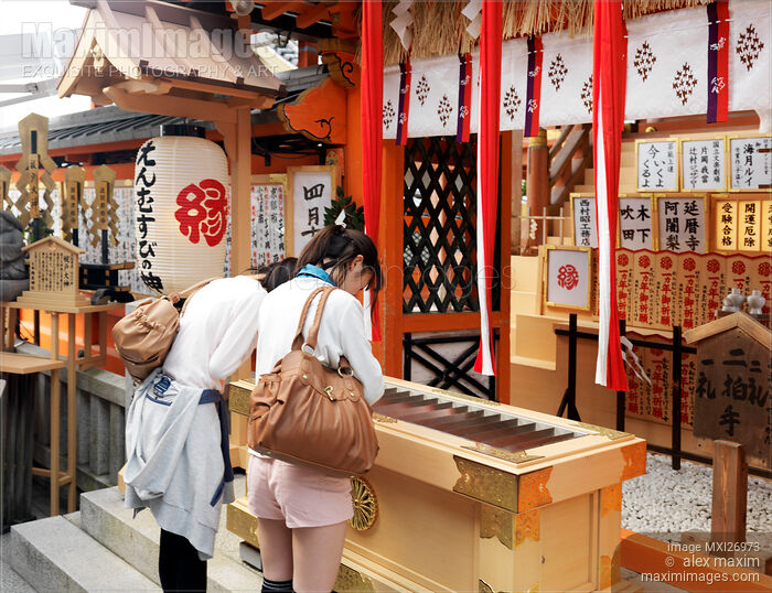 People at Jishu Jinja shrine of Kiyomizu-dera temple in Kyoto Stock photo of People at Jishu Jinja shrine of Kiyomizu-dera temple in Kyoto Buy commercial use license at MaximImages