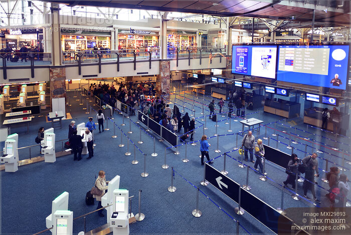 People at Vancouver International Airport arrivals security counters interior Stock photo of People at Vancouver International Airport arrivals security counters interior Buy commercial use license at MaximImages