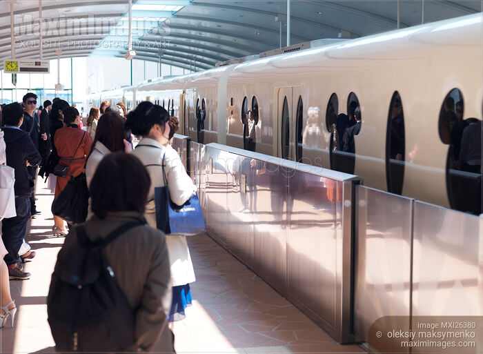 Stock photo of People boarding Disney Resort Line train in Tokyo Buy commercial use license at MaximImages