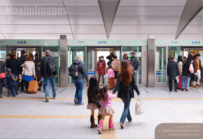 Stock photo of People boarding Yurikamome automated train in Tokyo Japan Buy commercial use license at MaximImages