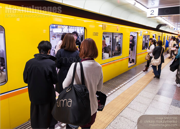 Stock photo of People entring subway train in Tokyo Buy commercial use license at MaximImages