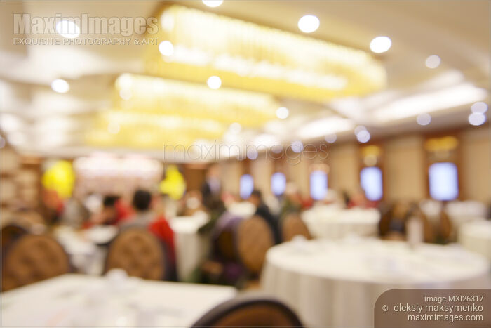 Stock photo of People in restaurant out of focus Buy commercial use license at MaximImages
