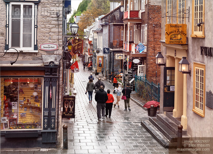 People in the rain on Rue du Petit Champlain historic street with its colorful stores of Old Quebec City Stock photo of People in the rain on Rue du Petit Champlain historic street with its colorful stores of Old Quebec City Buy commercial use license at MaximImages
