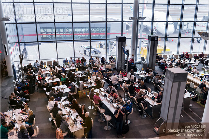 Stock photo of People in waiting area of Toronto Pearson airport Buy commercial use license at MaximImages