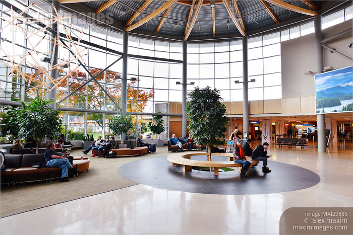 Stock photo of People in waiting lounge of Victoria International Airport Canada Buy commercial use license at MaximImages