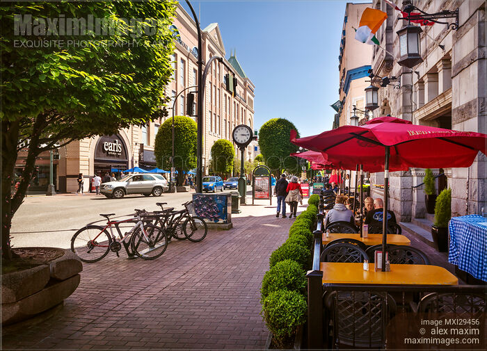 Stock photo of People on a terrace of Irish Times Pub restaurant in Victoria BC on a sunny day Buy commercial use license at MaximImages