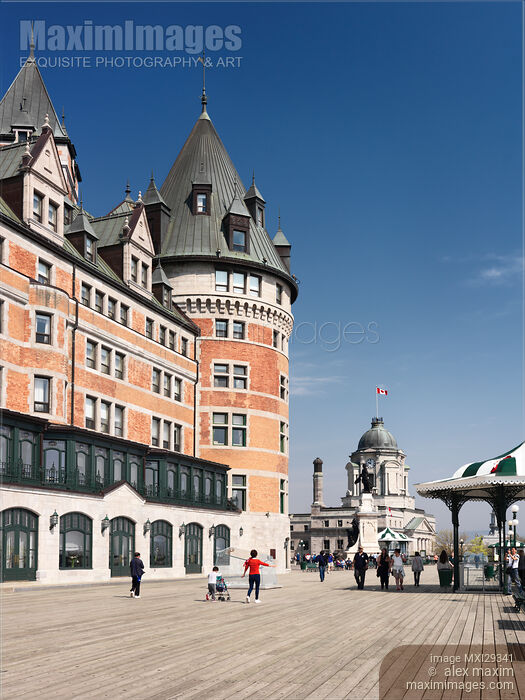Stock photo of People on Dufferin terrace boardwalk by the Fairmont Le Chateau Frontenac castle in old Quebec city Buy commercial use license at MaximImages
