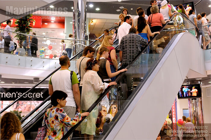 Stock photo of People on Escalator in Shopping Mall Buy commercial use license at MaximImages