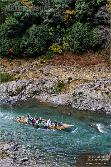 Stock photo of People on Hozugawa river sightseeing cruise boat ride Japan Buy commercial use license at MaximImages