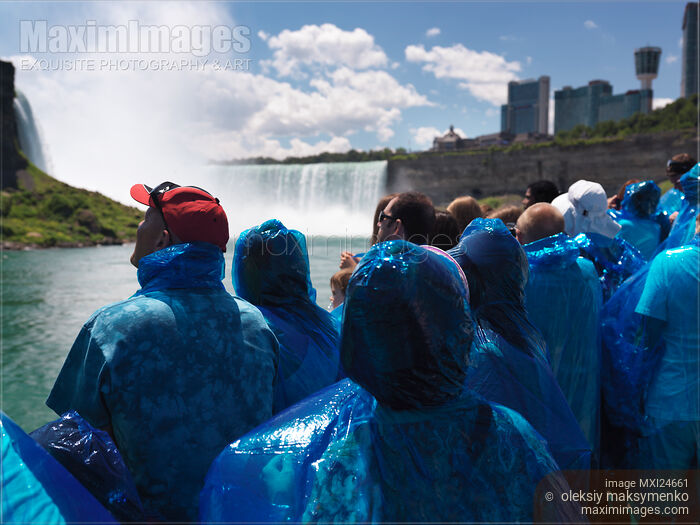 Stock photo of People on Niagara Falls Boat Ride Buy commercial use license at MaximImages