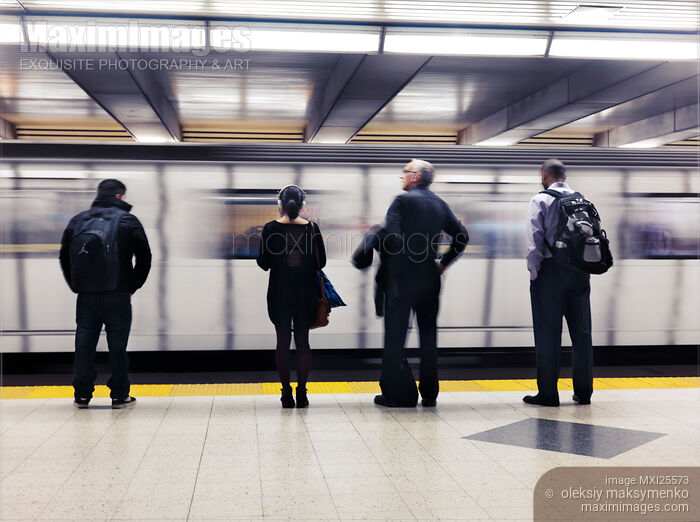 Stock photo of People on platform waiting for subway train Buy commercial use license at MaximImages