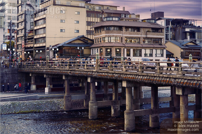 Stock photo of People on Sanjo bridge over Kamo River sunset scenery in Kyoto Japan Buy commercial use license at MaximImages