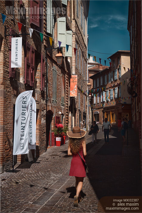 Stock photo of People on the streets of Albi town daytime city scenery South of France Buy commercial use license at MaximImages
