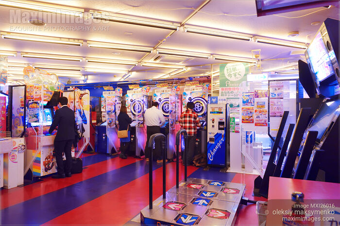 Stock photo of People playing arcade slot machines in Japan Buy commercial use license at MaximImages