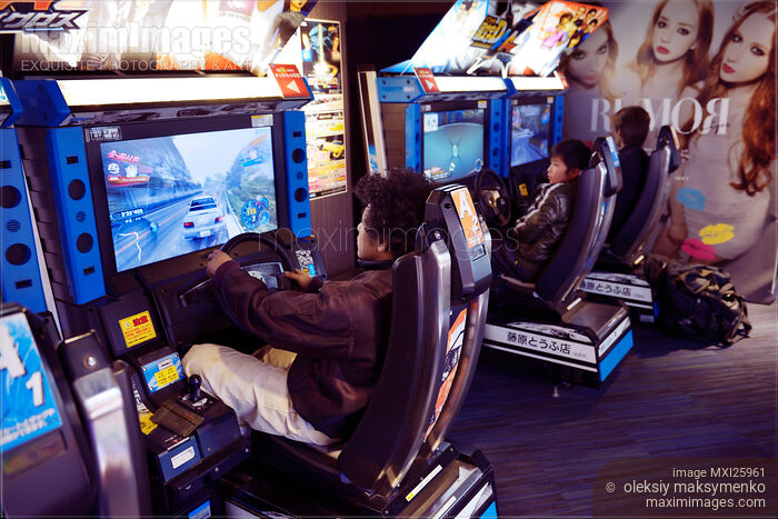 Stock photo of People playing at arcade in Japan Buy commercial use license at MaximImages