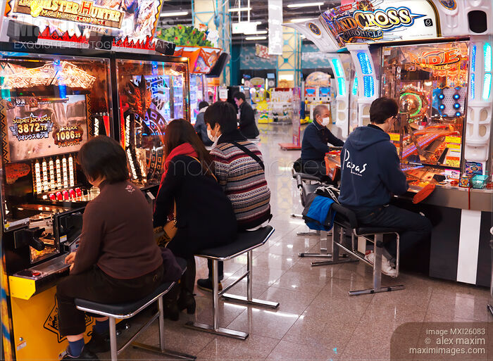 Stock photo of People playing at arcade in Odaiba Tokyo Buy commercial use license at MaximImages