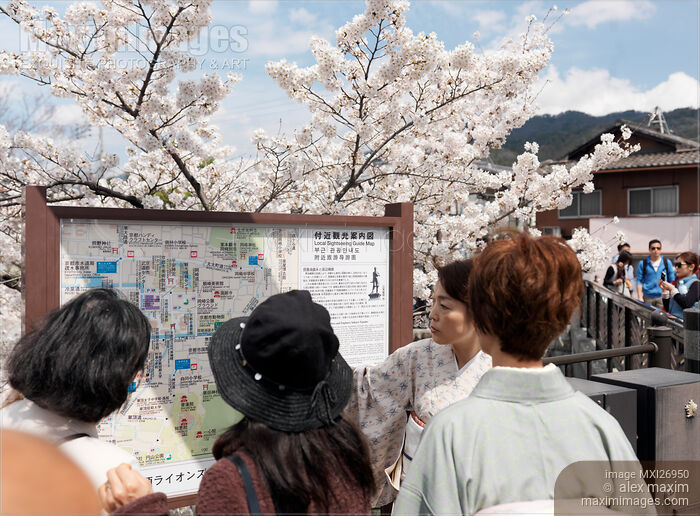 Stock photo of People reading sightseeing map in Kyoto Japan Buy commercial use license at MaximImages
