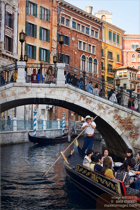 Stock photo of People taking a ride in Venetian gondola at Tokyo Disneysea Buy commercial use license at MaximImages