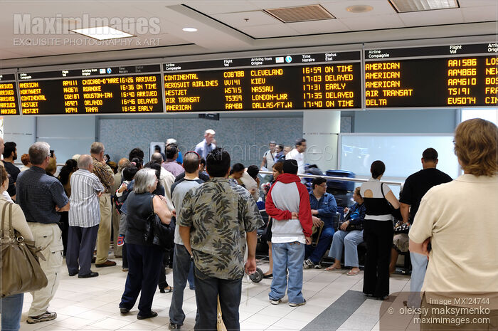 Stock photo of People Waiting at Airport Arrivals Hall Buy commercial use license at MaximImages