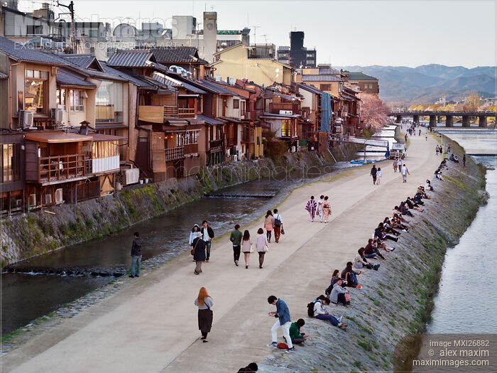 People walking along Kamo River in Kyoto Stock photo of People walking along Kamo River in Kyoto Buy commercial use license at MaximImages