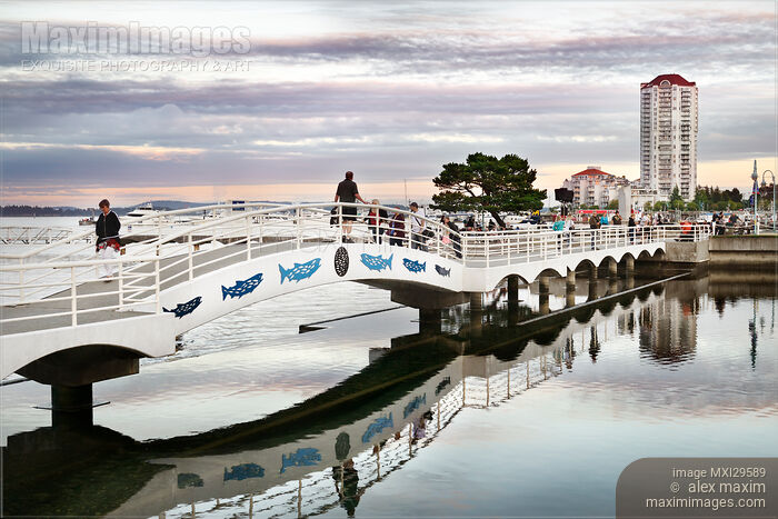 Stock photo of People walking on the bridge at Nanaimo Waterfront Vancouver Island Buy commercial use license at MaximImages