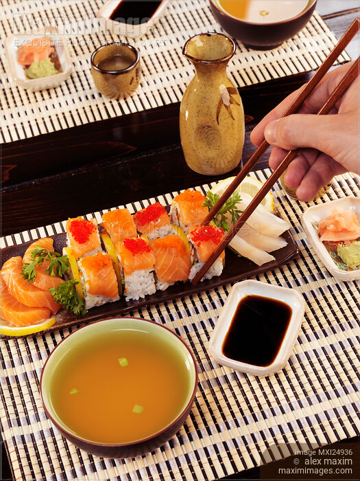 Stock photo of Person eating sushi at Japanese restaurant Buy commercial use license at MaximImages