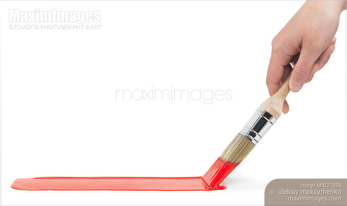 Person Painting with a Brush Dipped in Red Paint Stock photo of Person Painting with a Brush Dipped in Red Paint Buy commercial use license at MaximImages