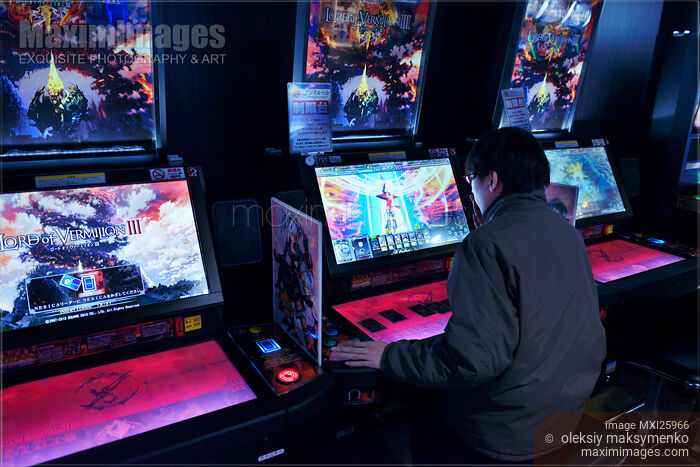 Person playing Lord of Vermilion arcade slot machines Stock photo of Person playing Lord of Vermilion arcade slot machines Buy commercial use license at MaximImages
