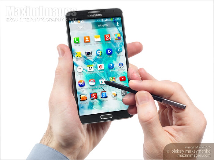Stock photo of Person using Samsung Galaxy Note III with pointer Buy commercial use license at MaximImages