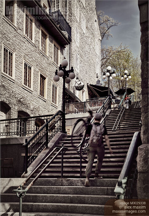 Person walking up the stairs of historic street Rue du Petit Champlain of Old Quebec City Stock photo of Person walking up the stairs of historic street Rue du Petit Champlain of Old Quebec City Buy commercial use license at MaximImages