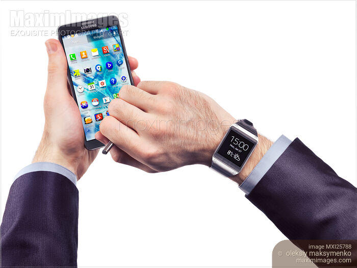 Stock photo of Person wearing Galaxy Gear watch Buy commercial use license at MaximImages