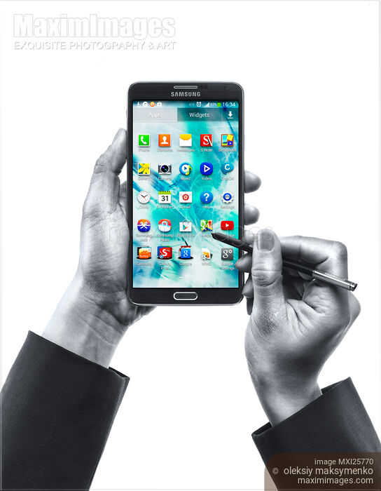 Stock photo of Person with Samsung Galaxy Note III in her hands Buy commercial use license at MaximImages