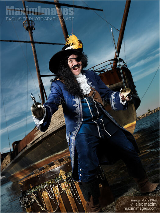 Stock photo of Pirate with a Treasure Chest Buy commercial use license at MaximImages