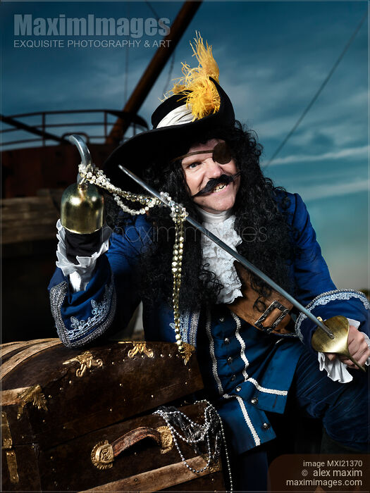 Pirate with a Treasure Chest Stock photo of Pirate with a Treasure Chest Buy commercial use license at MaximImages