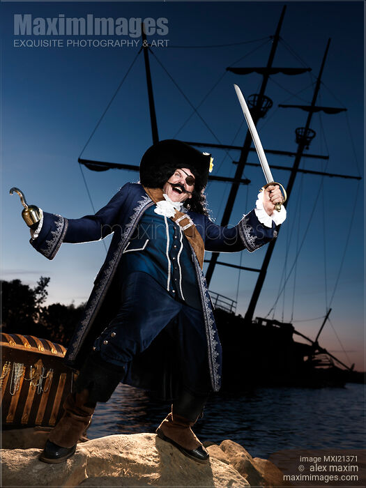 Stock photo of Pirate with a Treasure Chest Buy commercial use license at MaximImages