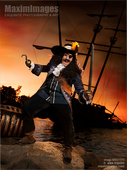 Pirate with a Treasure Chest Stock photo of Pirate with a Treasure Chest Buy commercial use license at MaximImages