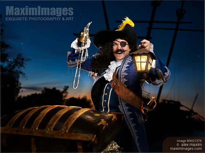 Pirate with a Treasure Chest Stock photo of Pirate with a Treasure Chest Buy commercial use license at MaximImages